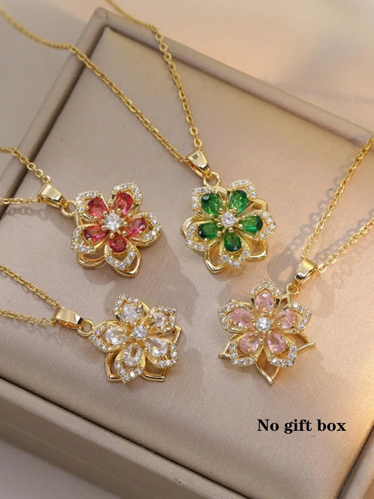 Four Vibe Atelier Rhinestone Flower Pendant Necklaces with red, green, clear, and pink stones, front view.